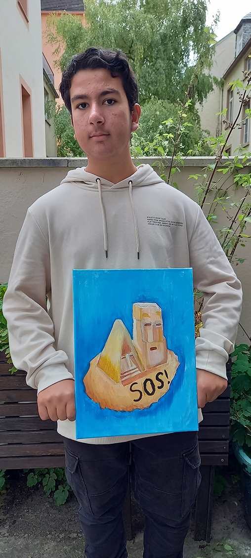 Student Sevan with his painting of Artsakh symbol