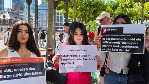 Sign reads “NK Blockade We won’t survive the winter. Catastrophic situation in NK”